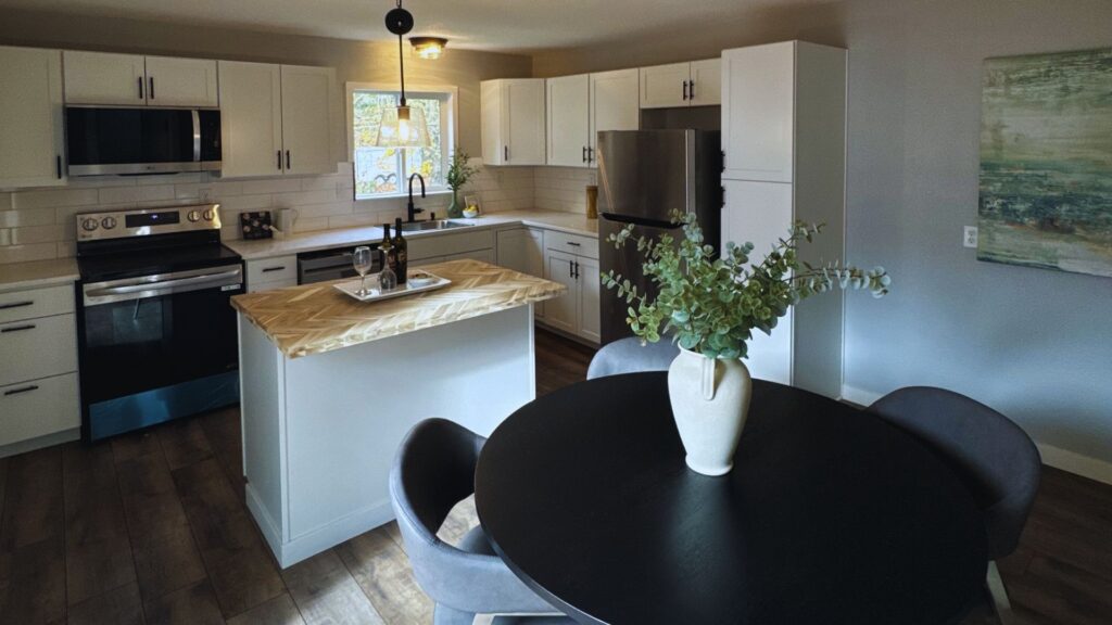 a freshly remodeled kitchen salem oregon with light paint scheme and dark accents with a view facing the interior of home