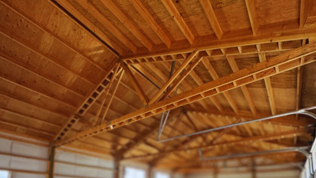 close up of interior view of framing work on a white oregon pole barn