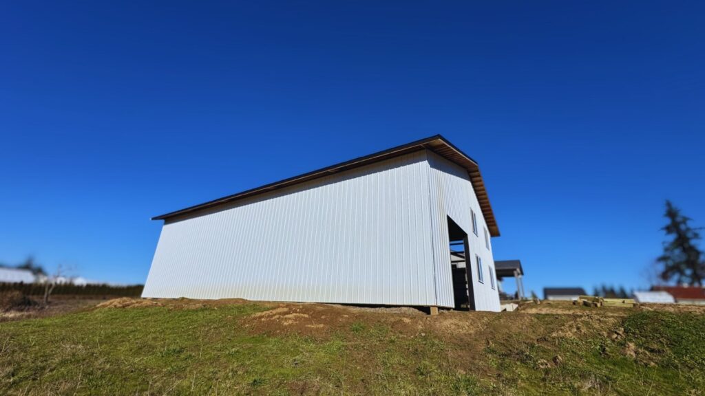 exterior view of completed white oregon pole barn