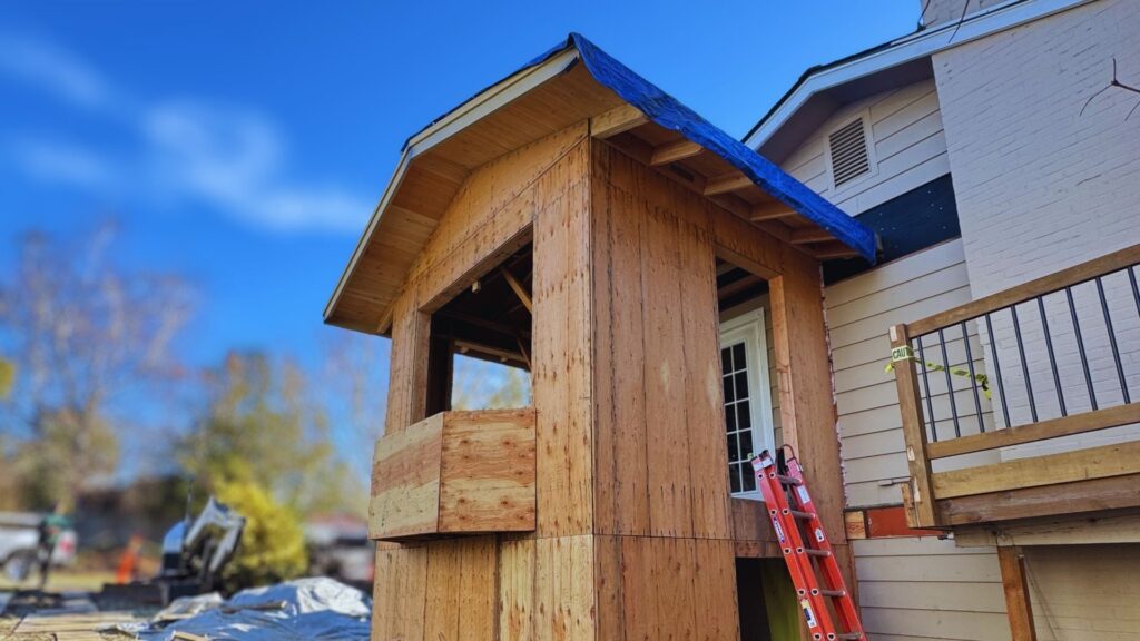 back view of an building a new addition onto an Oregon home with framing work completed