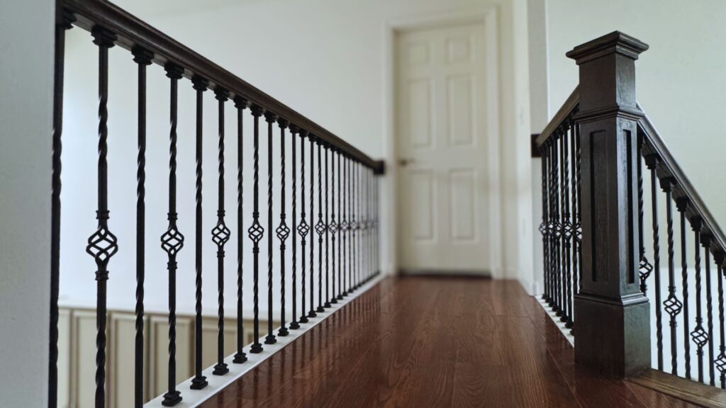 view of wrought iron support along back portion of the staircase